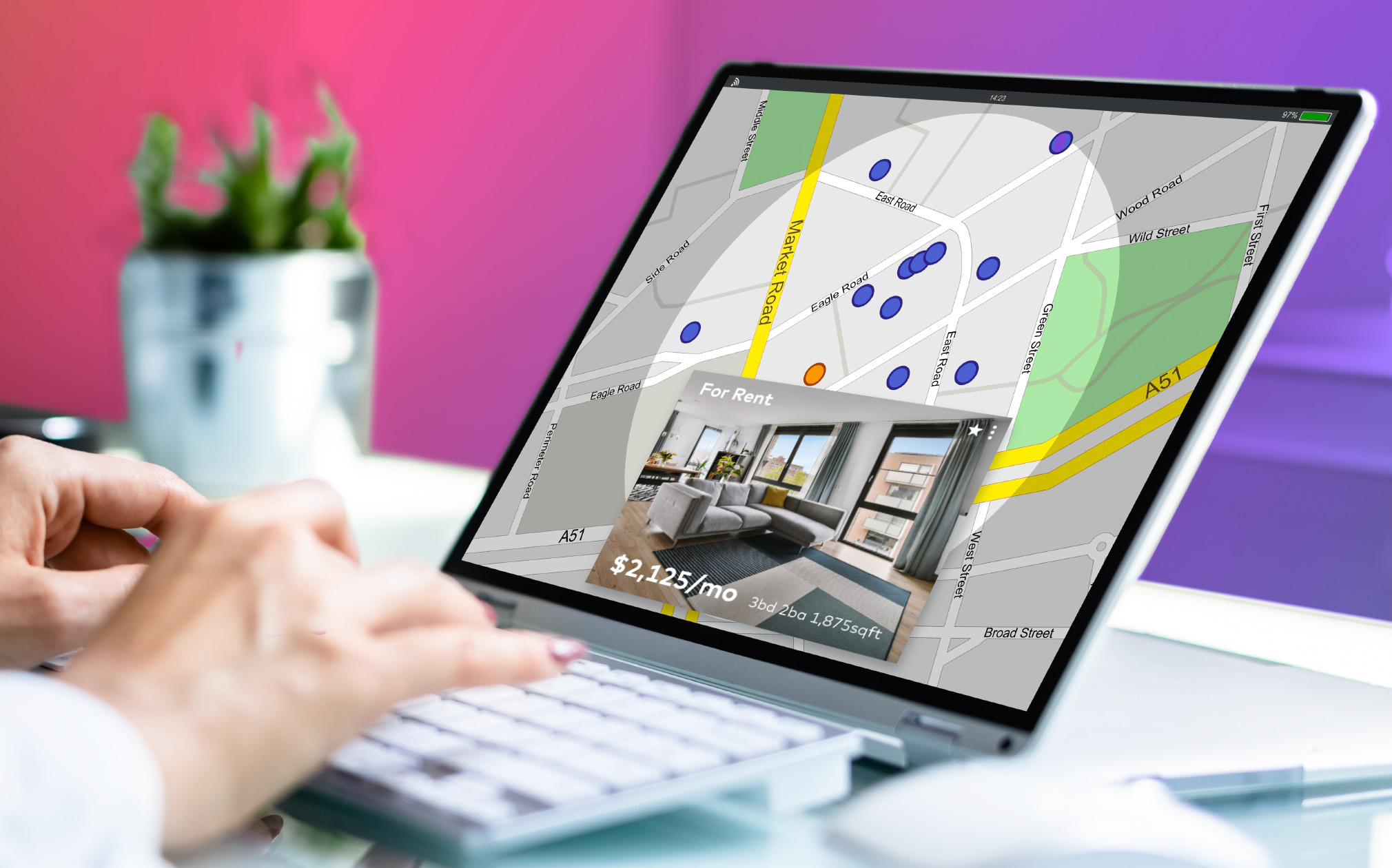 Renter searching for an apartment on a laptop thanks to neighborhood marketing